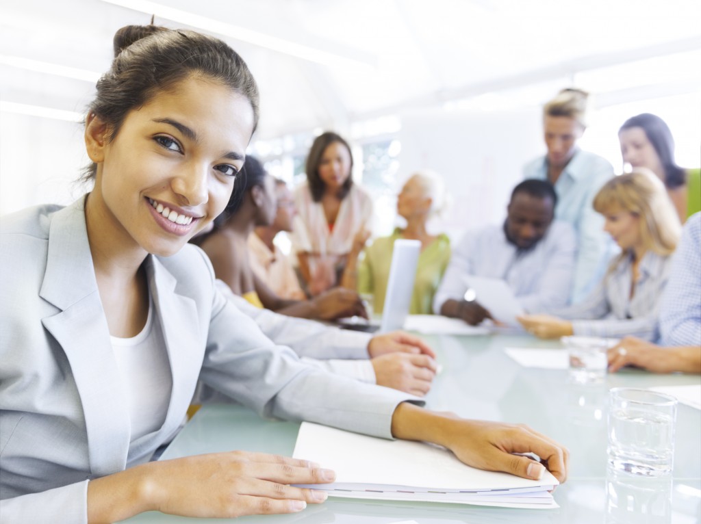 Black Business woman in conference with associates